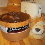 Lewis the Lion with an enormous tub of dulce de leche