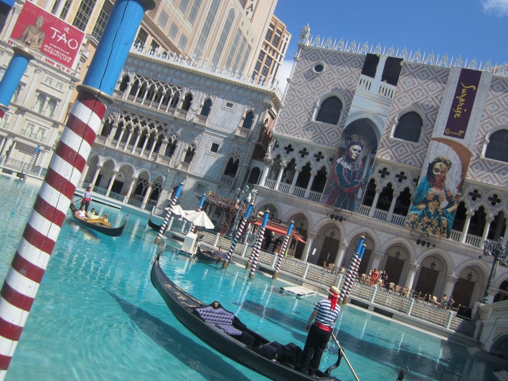 The gondoliers ride past in this fake Venice