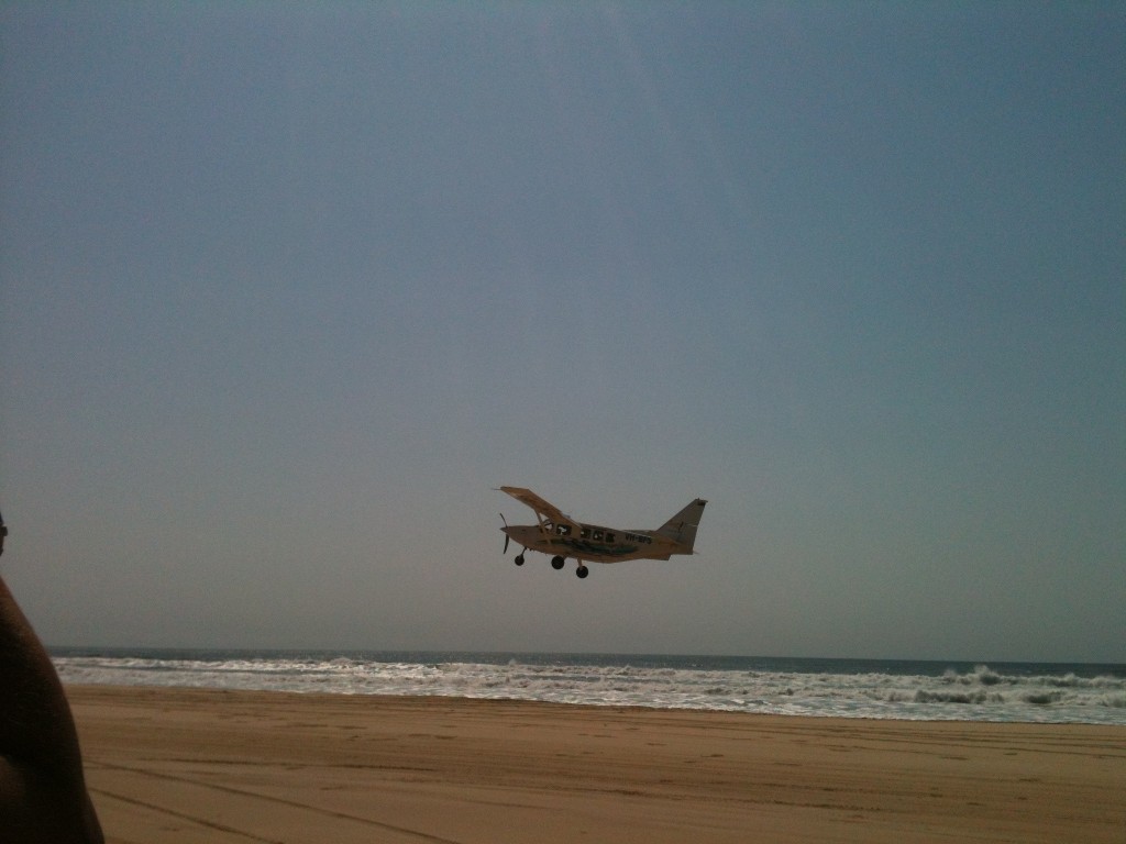 Helen takes a photo of Lewis' plane as it takes off over Fraser Island