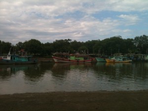 Boats line up along the jetty
