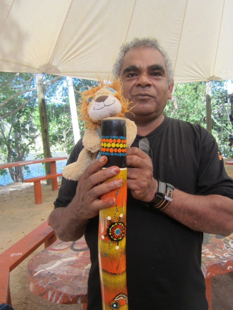 Lewis the Lion investigates the artwork on the didgeridoo