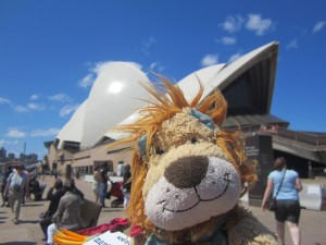 Lewis sees the huge sails of the Opera House behind him