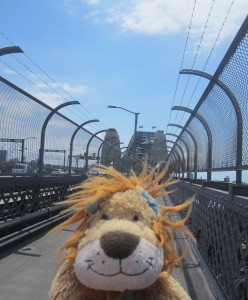 Lewis the Lion is on the pedestrian pathway to cross the iconic bridge