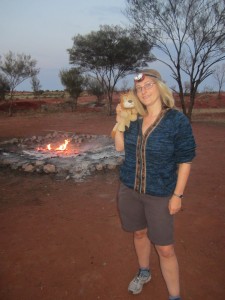 Helen wears her head torch by the smouldering bush bonfire
