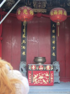 Lewis the Lion sees the altar outside the Buddhist Temple