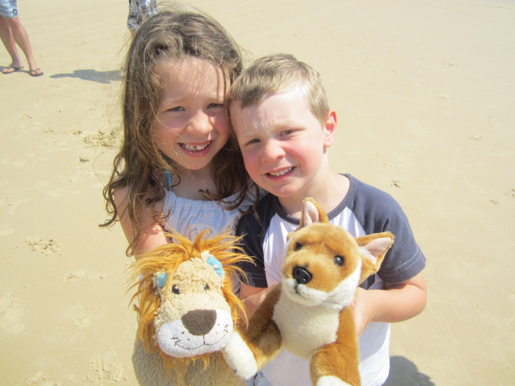 The children show Lewis the Lion their toy dingo