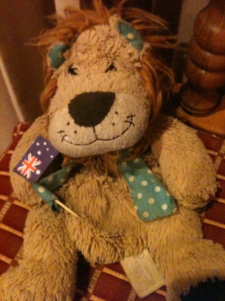 Lewis the Lion waves the Australian flag