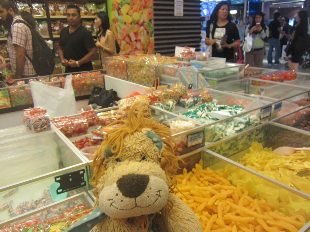 Sampling sweets and snacks in a Malaysian food court