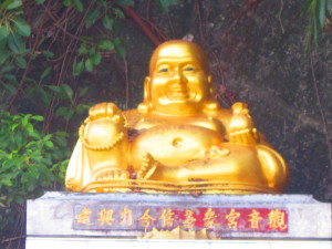 A golden Buddha smiles out at the world