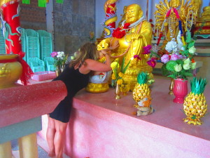 Rub one buddha's belly and whisper in the other buddha's ear