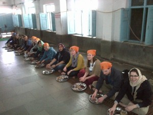 Having a community lunch in the Sikh Gurudwara, New Delhi