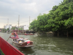 One of the floating markets approaches Lewis' boat