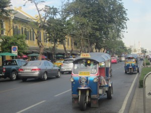 Tuk-tuks clamour for business by the Royal Palace