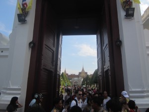 Guards monitor the crowds at the entrance to the Royal Palace