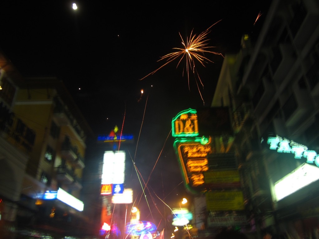 New Year fireworks fly over the Khao San Road at midnight