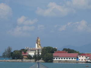Lewis the Lion spots a huge golden Buddha statue by the port