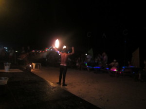 A fire-thrower entertains the crowd