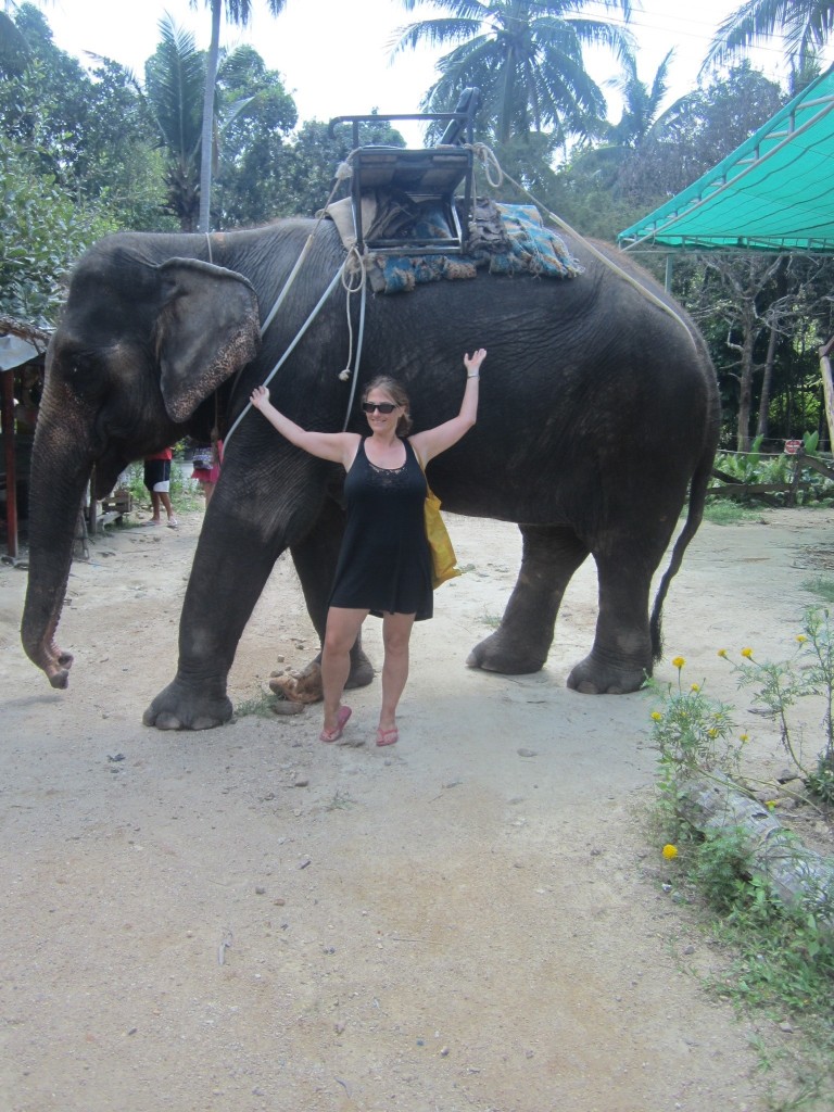 Helen looks so small next to the elephant