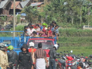 Flat-back vans crammed with people in Tana Toraja, Indonesia