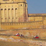 The elephants carry tourists up the steep slopes to the fort