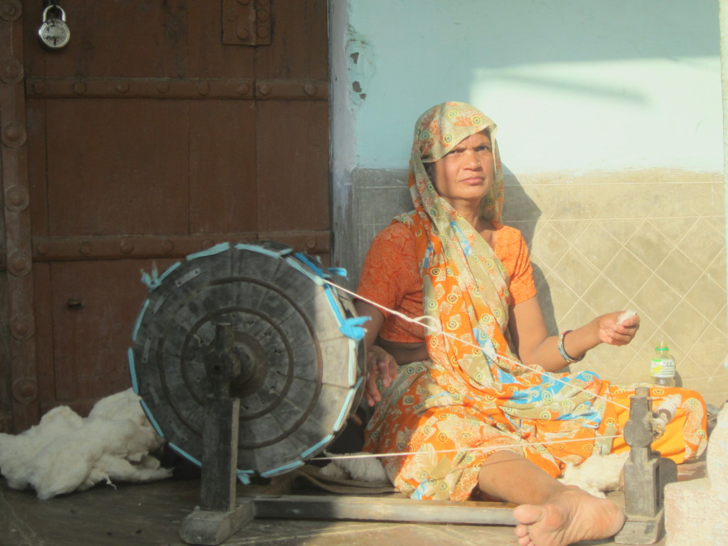 A woman spinning cotton
