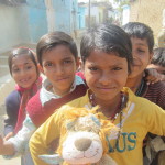 Local children greet Lewis the Lion