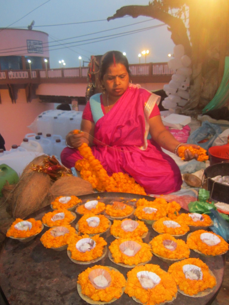 A candle-flower seller on the ghats of Varanasi