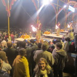 The pilgrims gather to see a Hindu religious ceremony by the water's edge