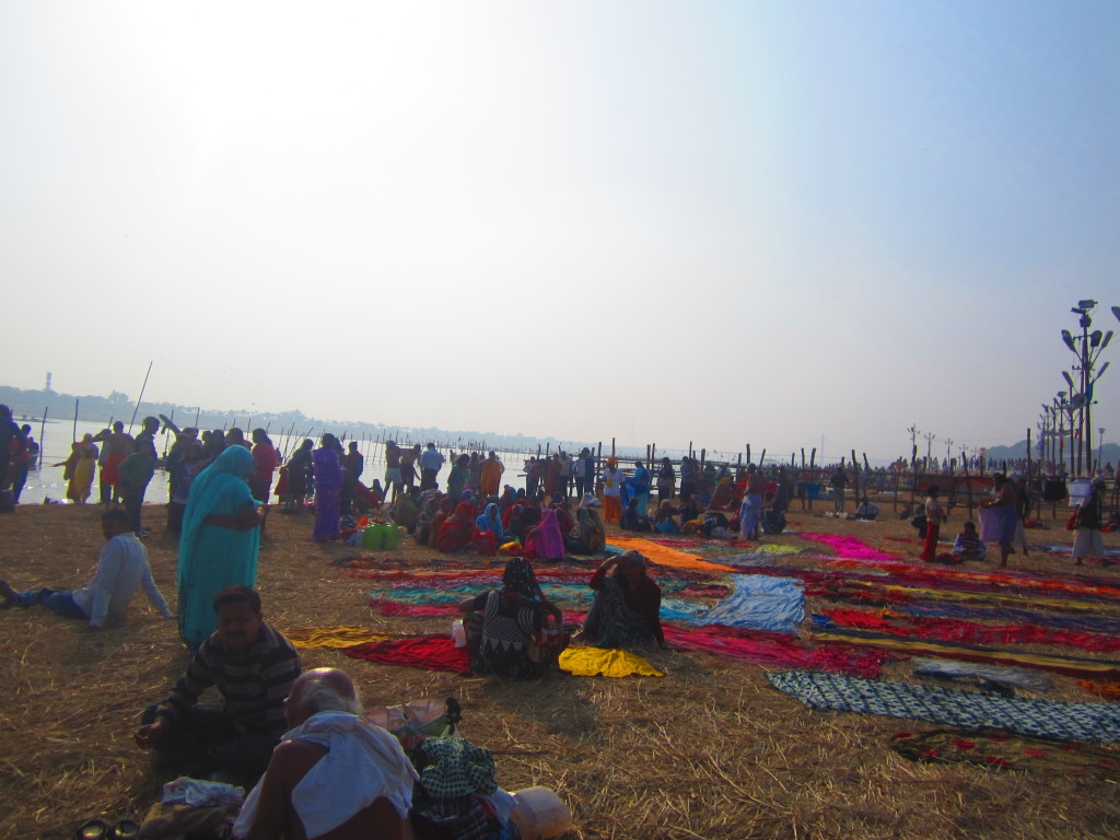 Saris are laid out to dry after people have taken the dip